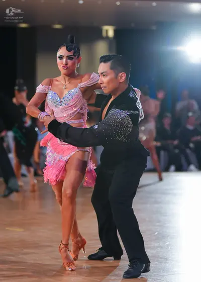 Dancesport competitor: Male dancer: black latin dance shirt with silver sequin embellishments on the sh