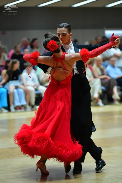 Dancesport competitor: Male dancer: black suit with a white shirt