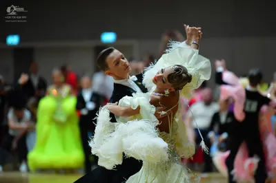 Dancesport competitor: Male dancer: black formal dance suit with a white shirt