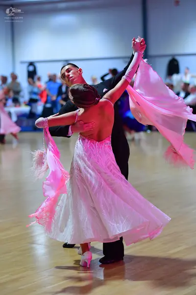 Dancesport competitor: Male dancer: black ballroom suit
