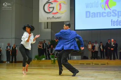Dancesport competitor: Male dancer: blue patterned blazer and black trousers