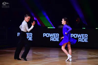 Dancesport competitor: Male dancer: white long-sleeved shirt and black trousers