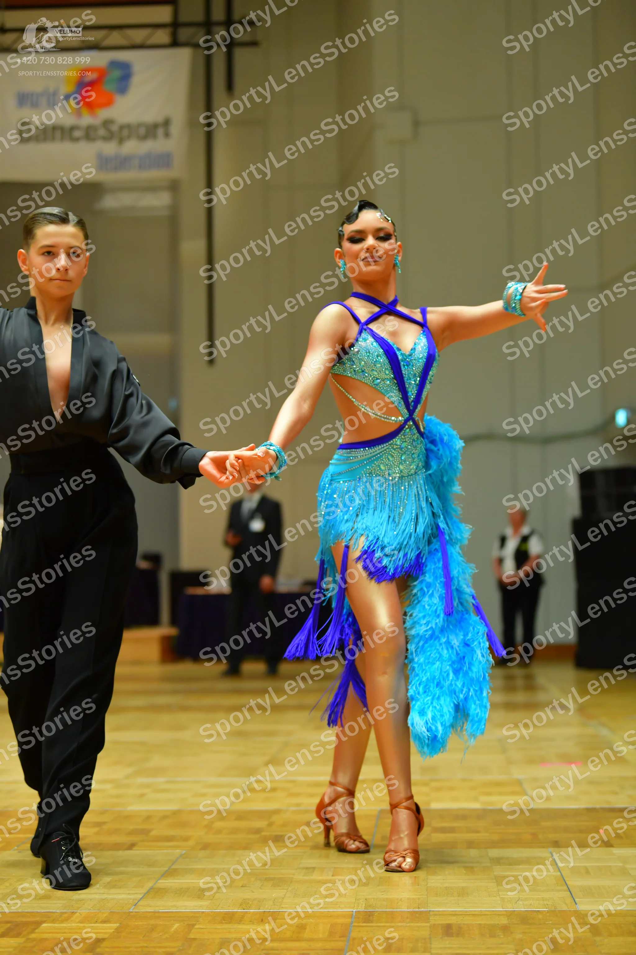 Dancesport competitor: Male dancer: black long-sleeved shirt and black trousers