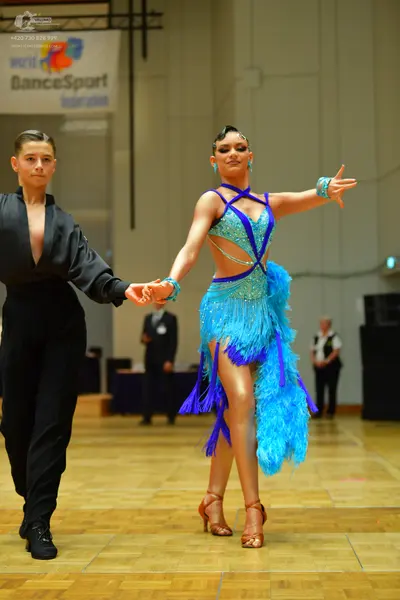 Dancesport competitor: Male dancer: black long-sleeved shirt and black trousers
