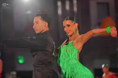 Dancesport competitor: Male dancer: dark charcoal or black suit jacket