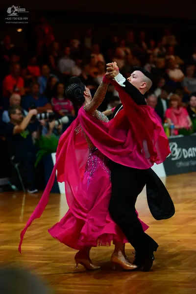 Dancesport competitor: Male dancer: black dance shirt and black trousers