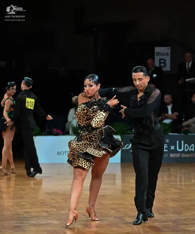 Dancesport competitor: Main female dancer: leopard print latin dress with ruffles