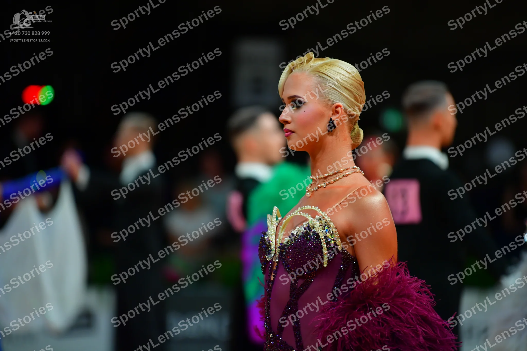 Dancesport competitor: Female dancer: burgundy Latin dress with a gold and silver embellished bodice an