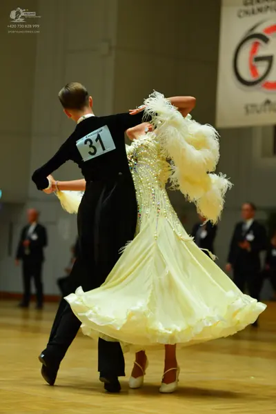 Dancesport competitor: Male dancer: black long-sleeved shirt and black trousers