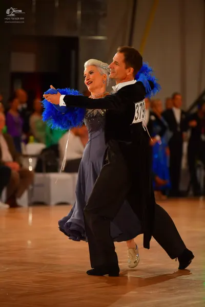 Dancesport competitor #379: Male dancer: black tailcoat with long tails, black trousers, and black dance sho