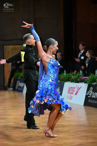 Dancesport competitor: Male dancer: black long-sleeved shirt and black trousers