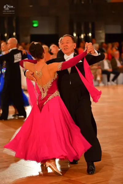 Dancesport competitor #234: Male dancer (left): black suit