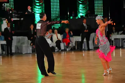 Dancesport competitor #184: Male dancer: black long-sleeved shirt and black trousers