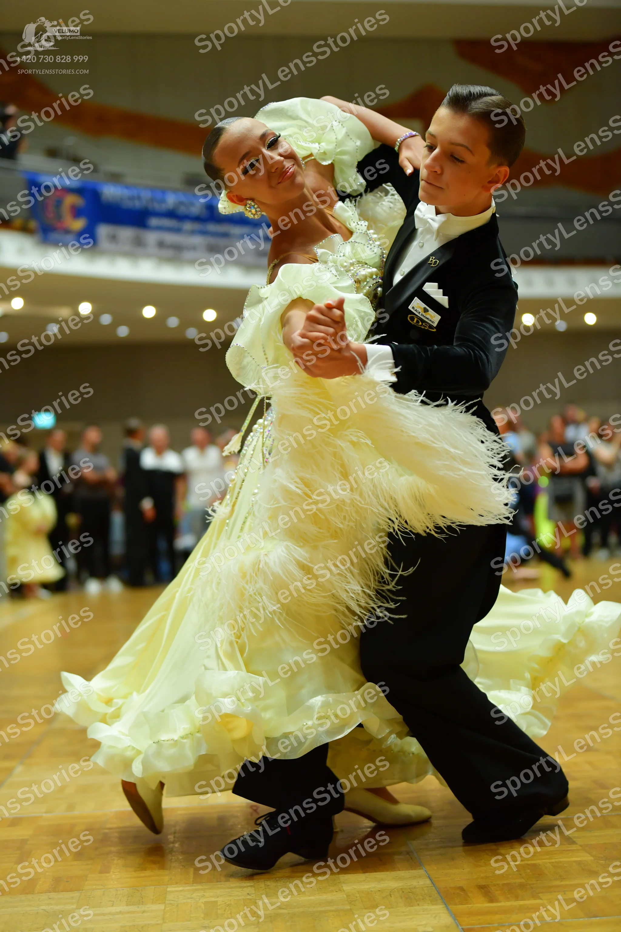 Dancesport competitor: Male dancer: black suit with a white shirt and black trousers
