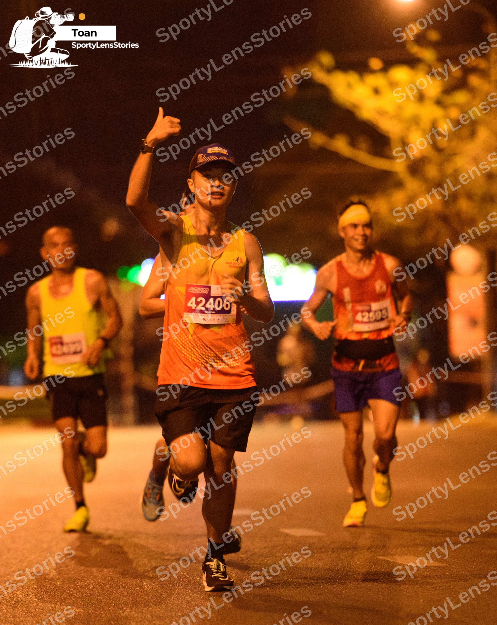Marathon runner #42406, #42595: Runner 1: yellow tank top, black shorts, yellow shoes
