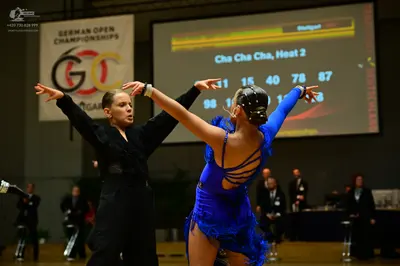 Dancesport competitor #11, #15: Female dancer: blue latin dress with fringe and thin straps
