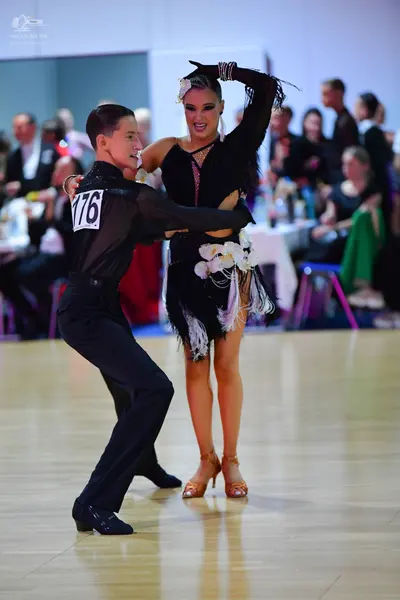 Dancesport competitor #176: Male dancer: black long-sleeved dance shirt and black trousers