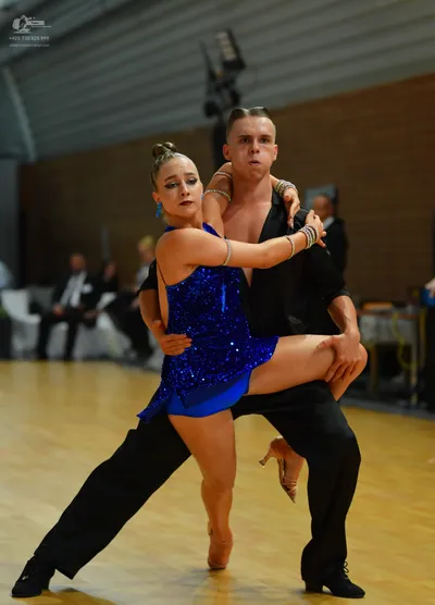 Dancesport competitor: ** Black tail suit