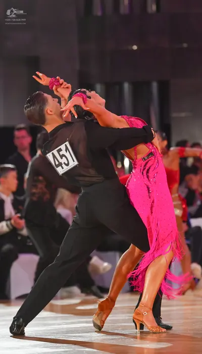 Dancesport competitor #451: Male dancer: black long-sleeved shirt and black trousers