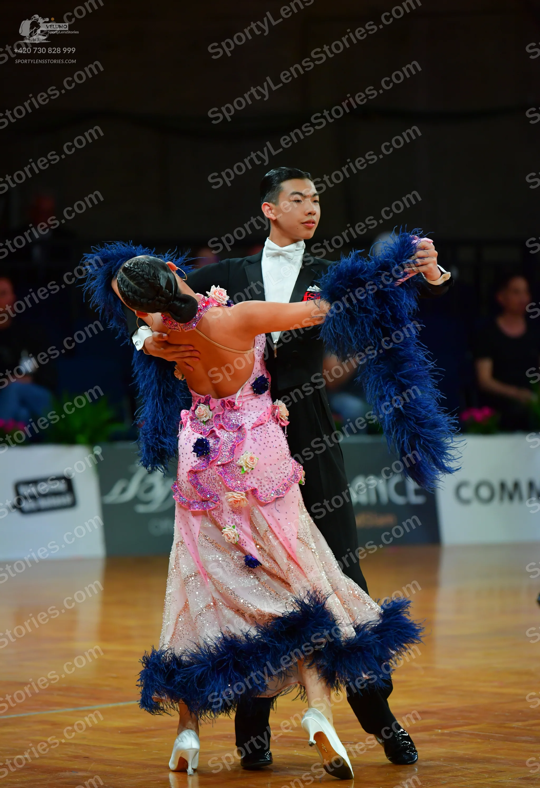 Dancesport competitor: Male dancer: black suit with a white shirt and white bowtie