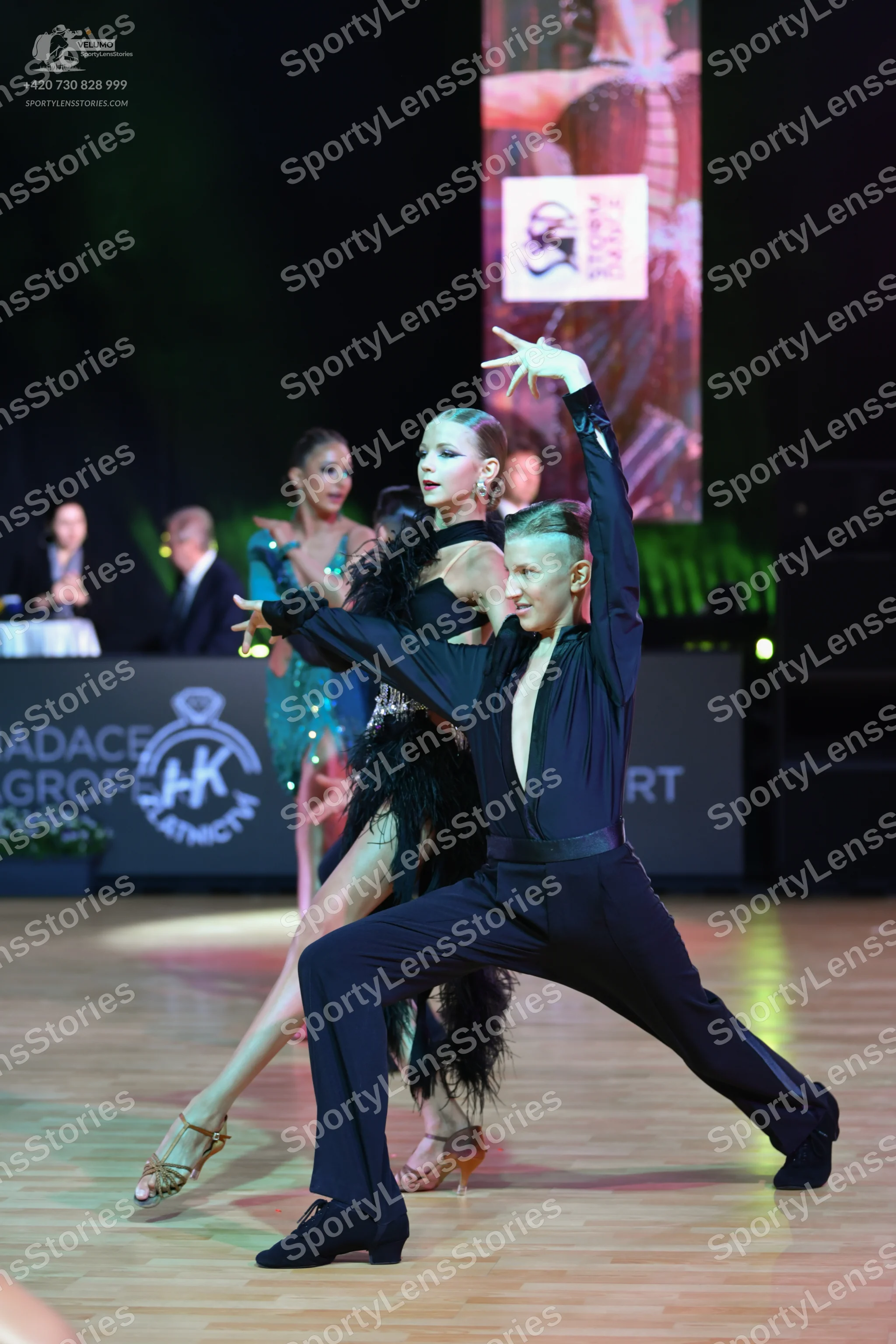 Dancesport competitor: Male dancer: black long-sleeved shirt and black trousers