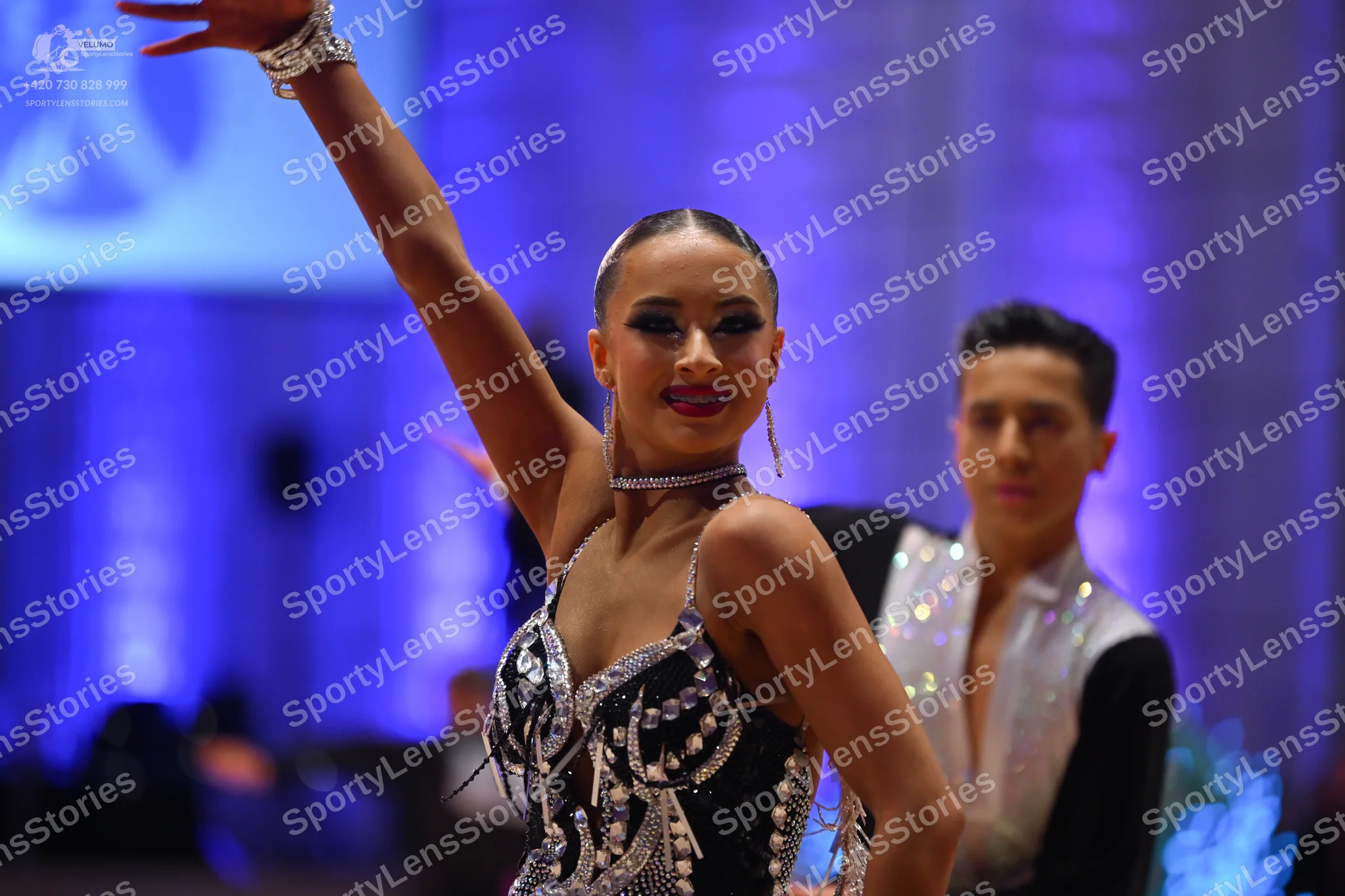 Dancesport competitor: Male dancer: black and white Latin dance shirt with a white, possibly sequined,