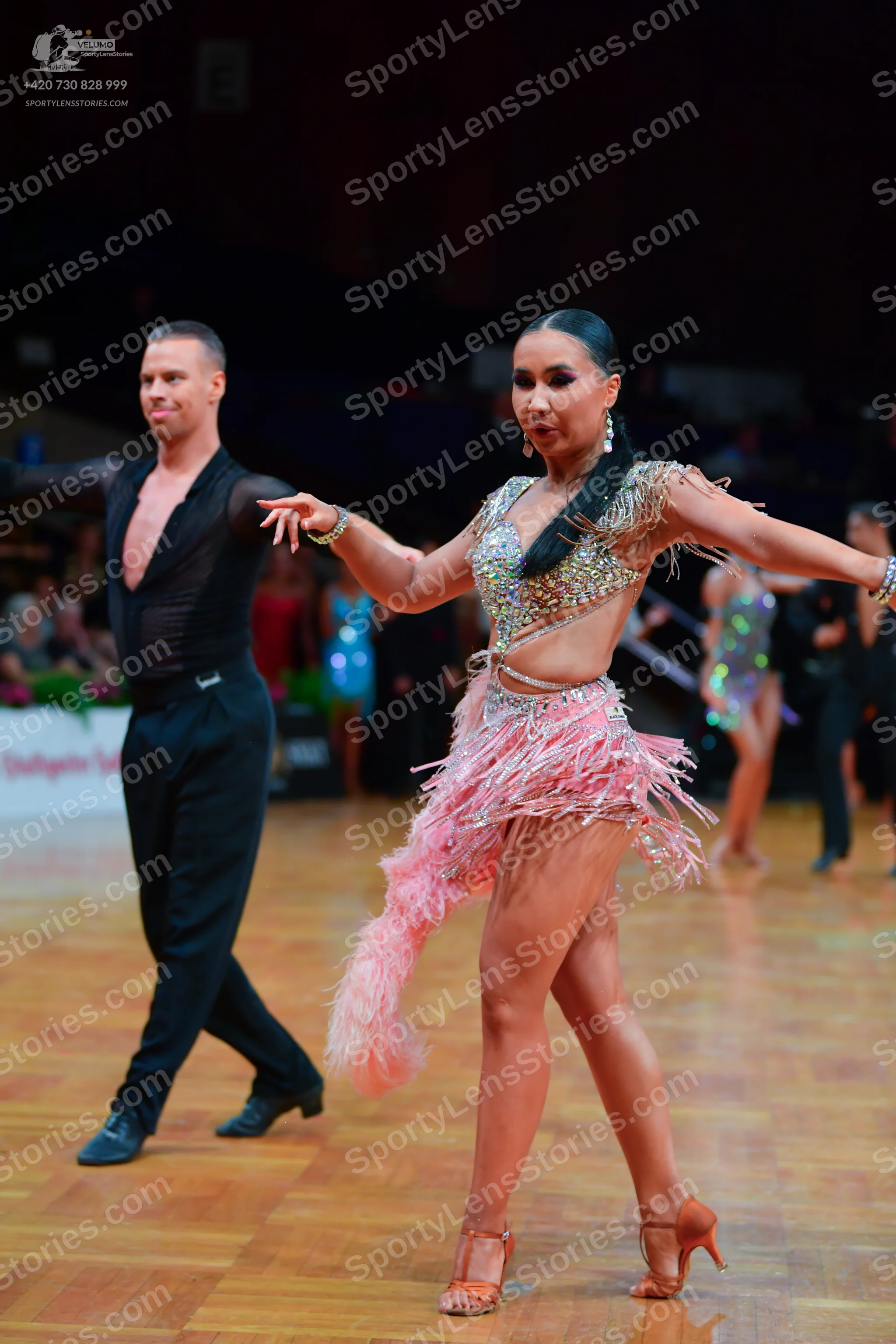 Dancesport competitor: Male dancer: black long-sleeved tight-fitting top and black trousers
