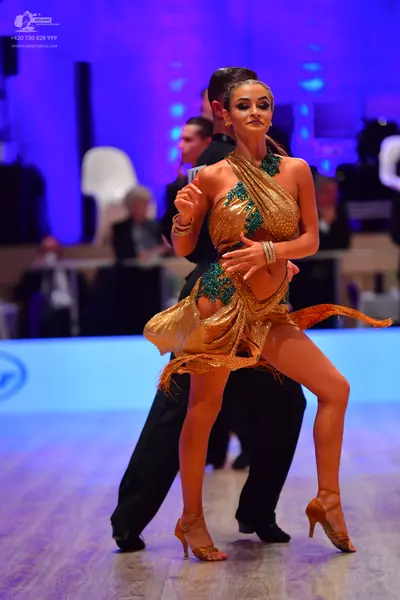 Dancesport competitor: Male dancer: black suit