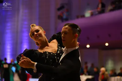Dancesport competitor: Male dancer: black suit with a white shirt