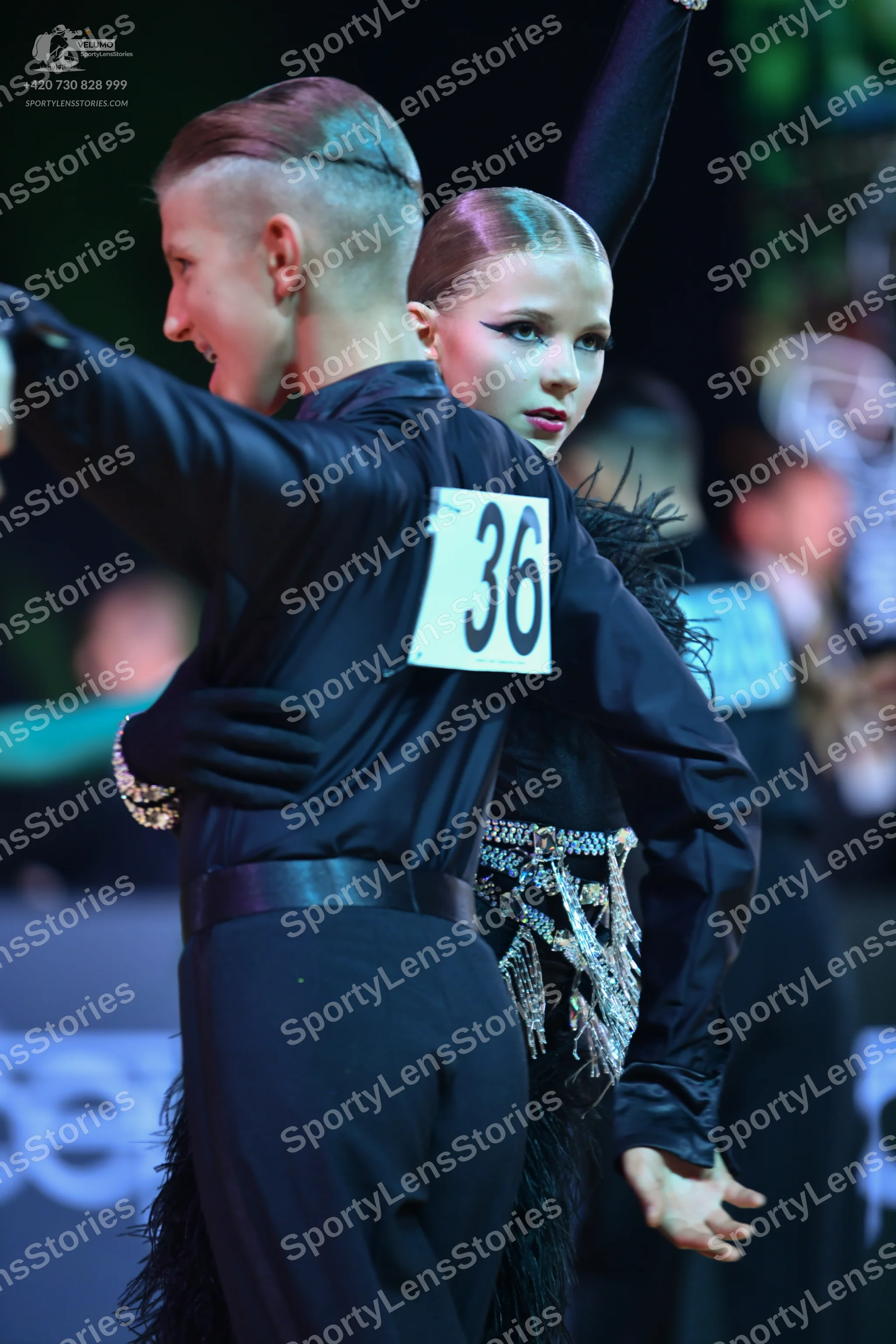 Dancesport competitor: Male dancer: black long-sleeved shirt and black trousers
