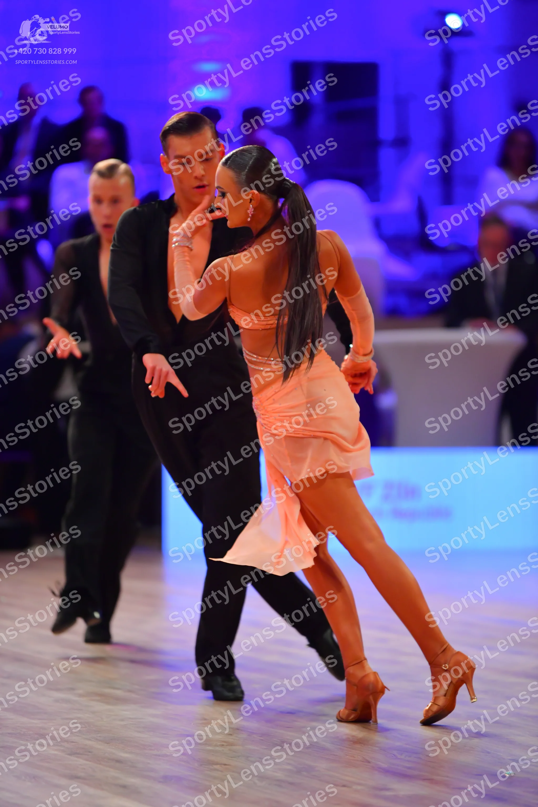 Dancesport competitor: Man on the left: black long-sleeved shirt and black trousers