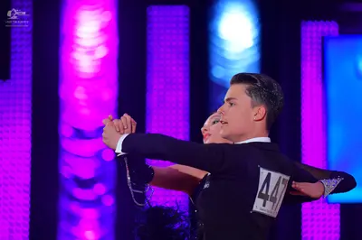 Dancesport competitor #447: Male dancer: black suit jacket