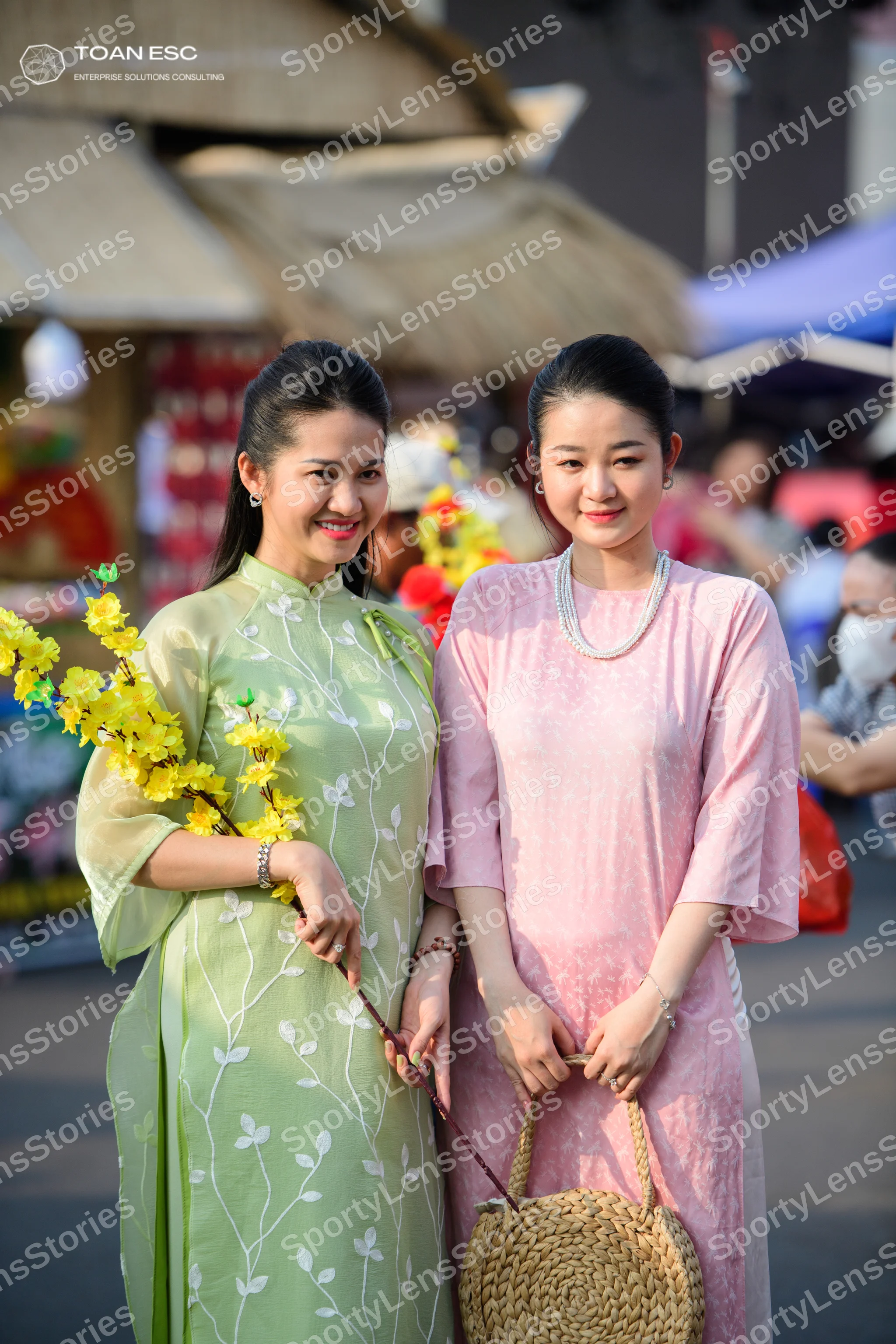 Dancesport competitor: Female dancer 1: light green long-sleeved dress with a white floral pattern and