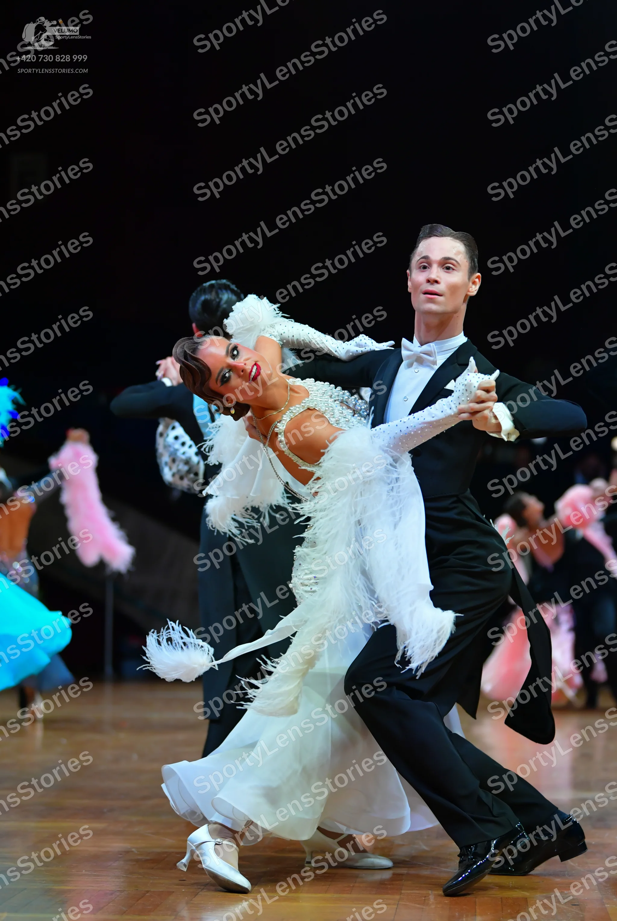 Dancesport competitor: Male dancer: black tailcoat suit, white shirt, and white bowtie