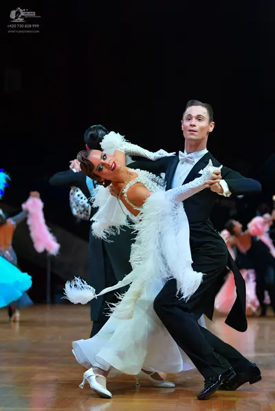 Dancesport competitor: Male dancer: black tailcoat suit, white shirt, and white bowtie