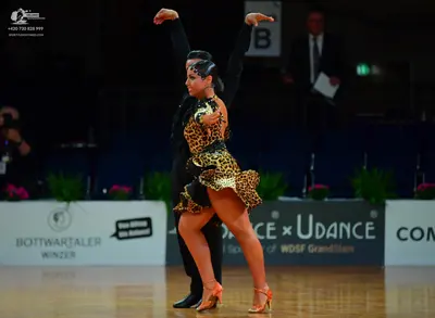 Dancesport competitor: Male dancer: black long-sleeved dance suit