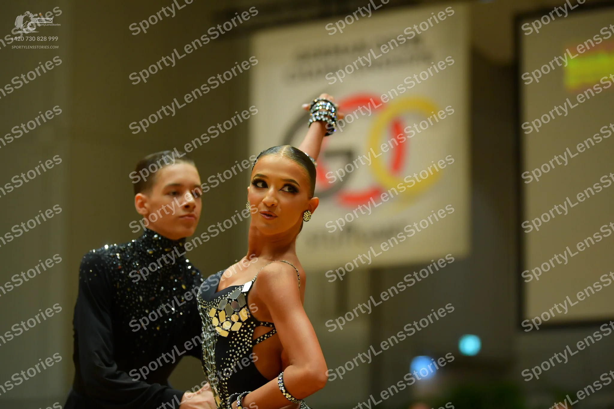 Dancesport competitor: Male dancer: black long-sleeved top with silver sequins on the chest