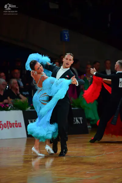 Dancesport competitor: Male dancer: black suit with white shirt