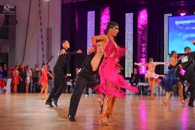 Dancesport competitor: Male dancers: black long-sleeved shirts and black trousers