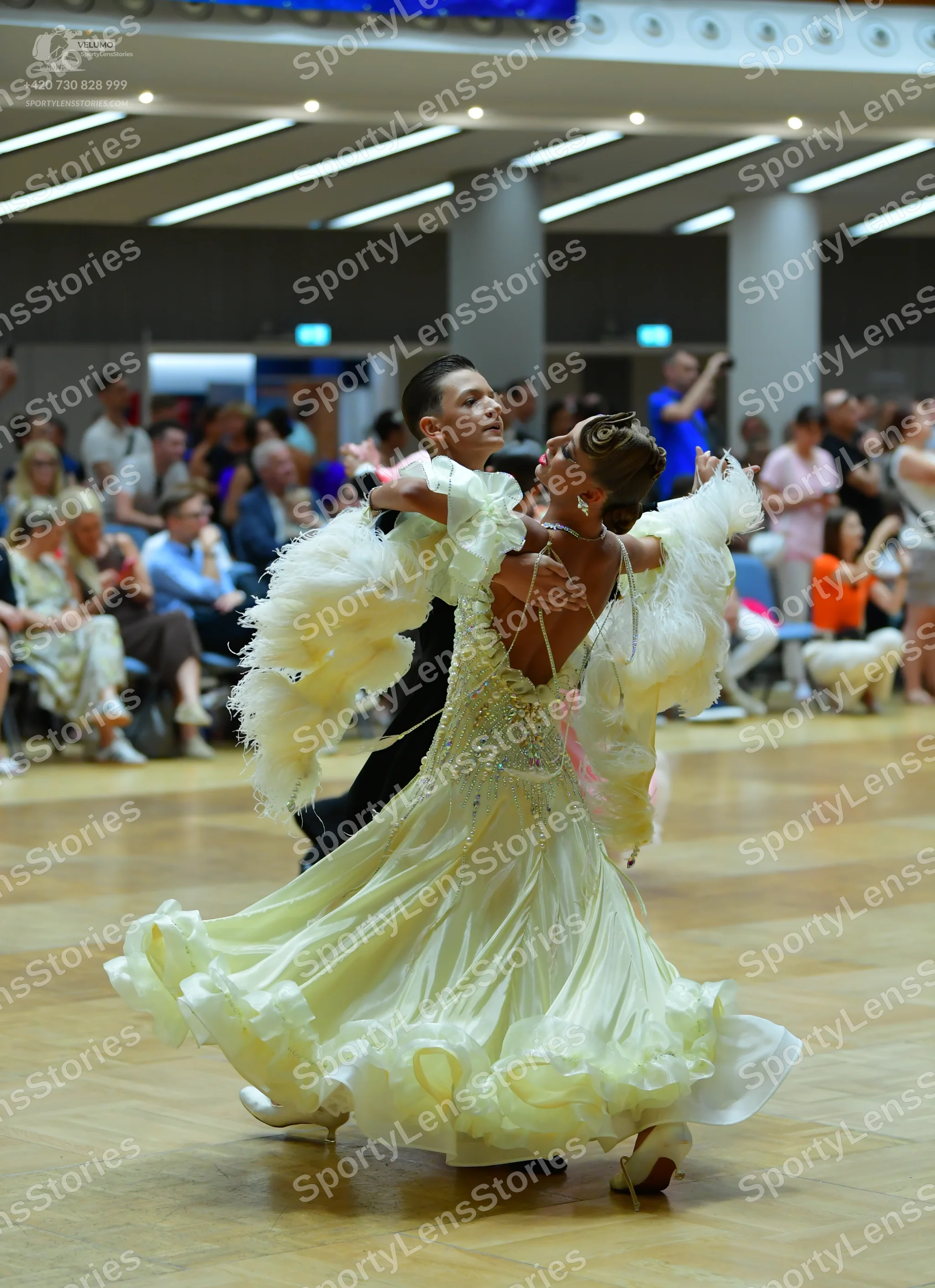 Dancesport competitor: Male dancer: black suit with a white shirt