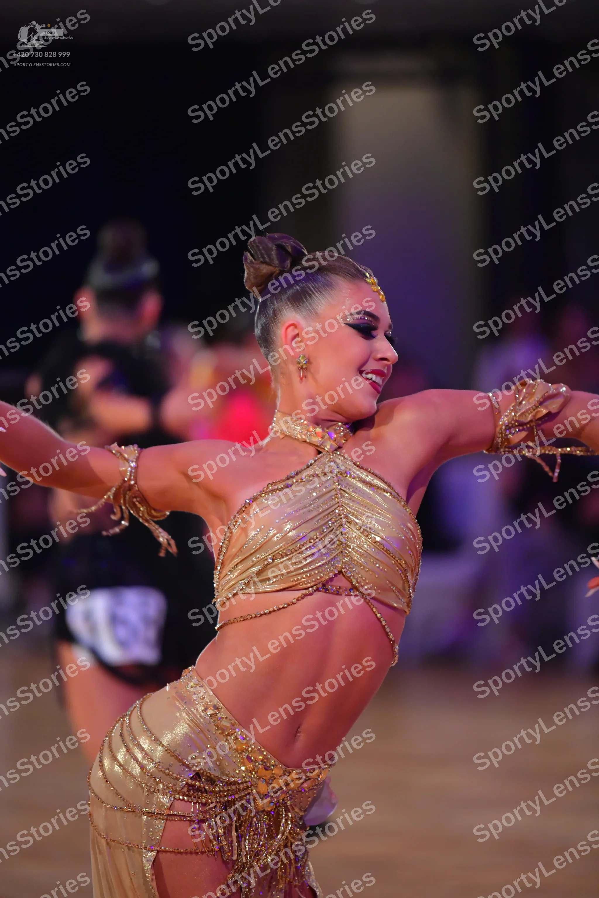 Dancesport competitor #69: Female dancer: gold latin dance two-piece costume with sequins and metallic frin