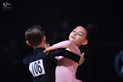 Dancesport competitor: Male dancer: black long-sleeved shirt