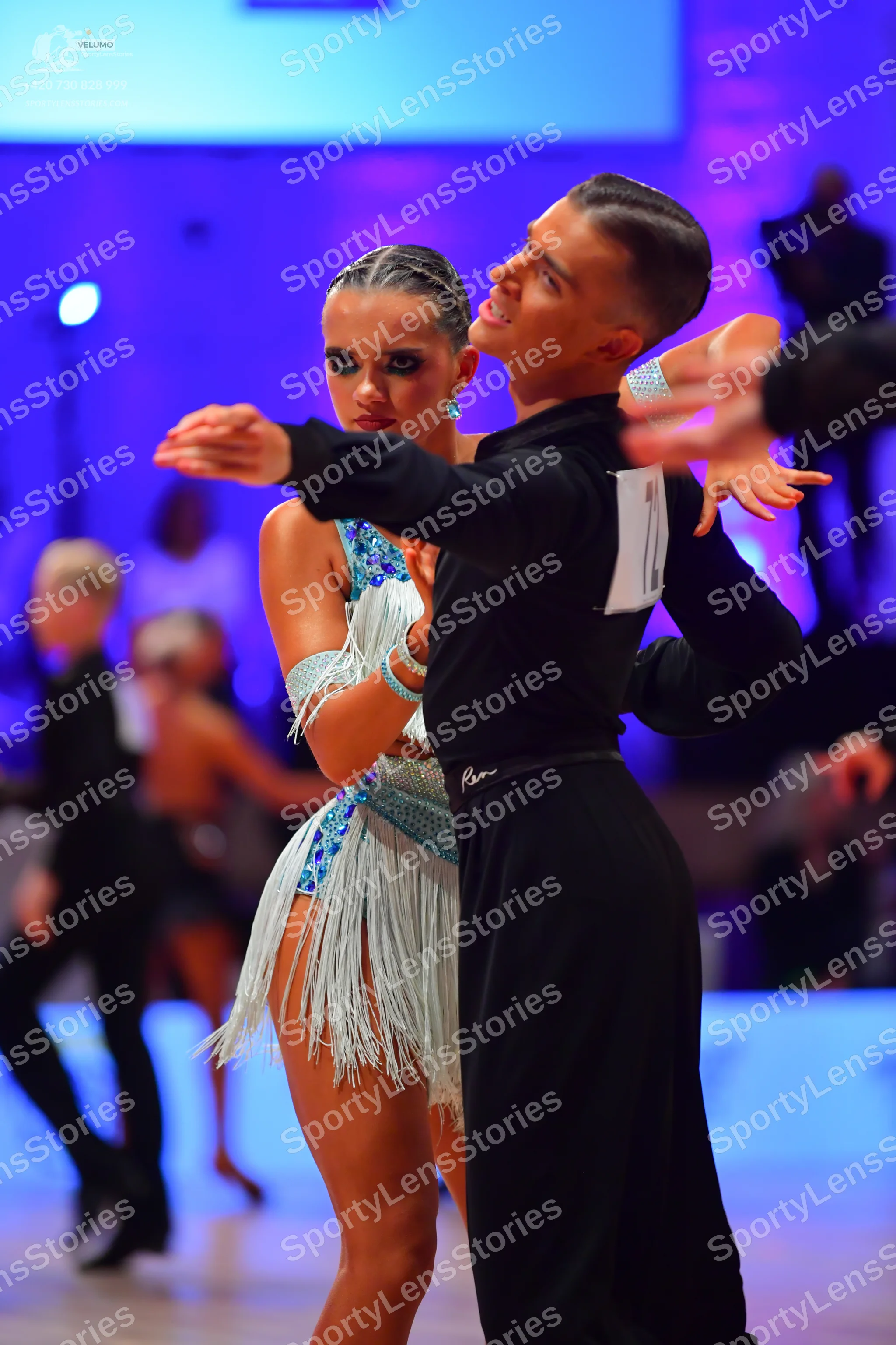 Dancesport competitor: Male dancer: black long-sleeved shirt and black trousers