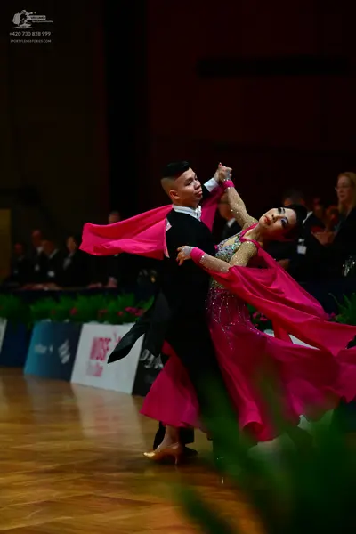 Dancesport competitor: Male dancer: black long-sleeved dance top and trousers