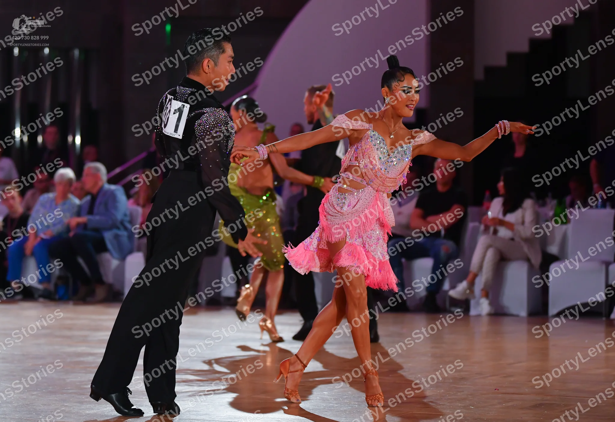 Dancesport competitor: Male dancer: black long-sleeved shirt with silver sequin detail on the shoulder