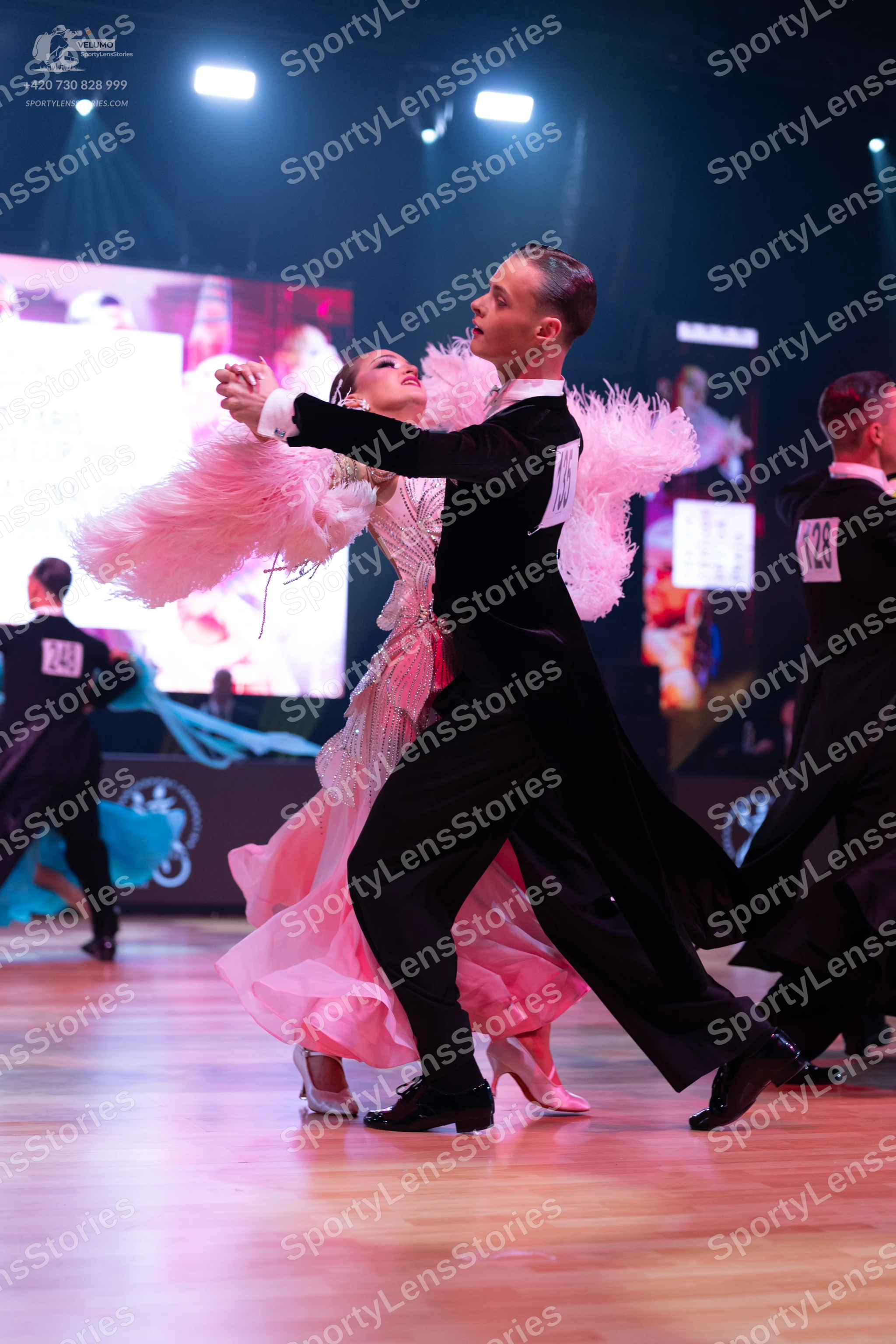 Dancesport competitor: Male dancer: black ballroom suit with a white shirt