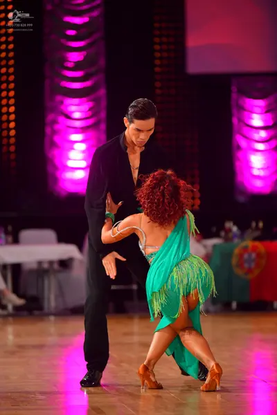 Dancesport competitor: Male dancer: black long-sleeved shirt and black trousers
