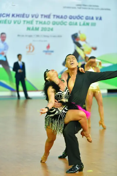 Dancesport competitor: ** Black suit with a white satin jacket and trousers