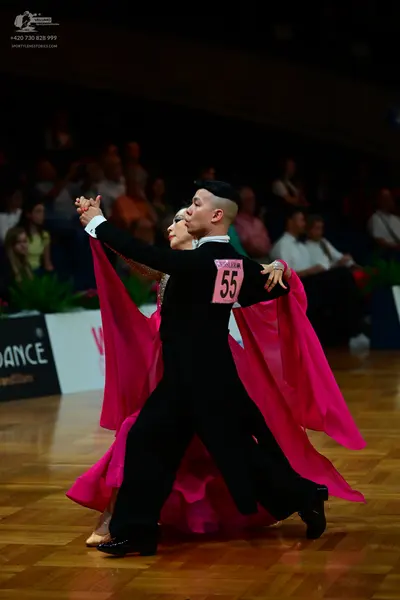 Dancesport competitor #55: Male dancer: black long-sleeved shirt and black trousers