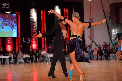 Dancesport competitor: Male dancer: black suit